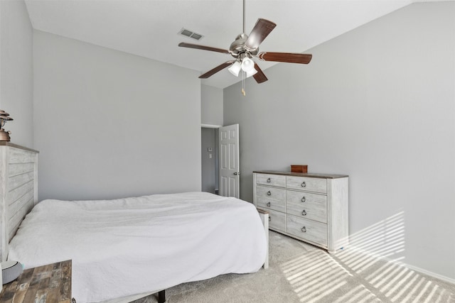 bedroom featuring light colored carpet, high vaulted ceiling, and ceiling fan