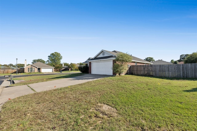 view of front of house with a front lawn and a garage