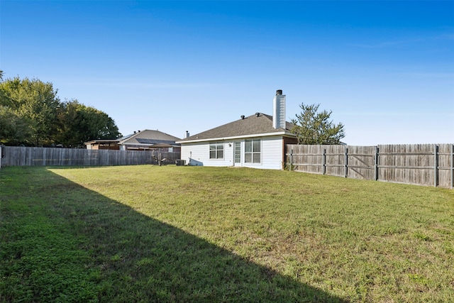 view of yard with central AC