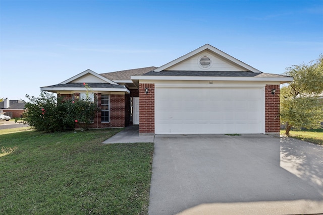 ranch-style home featuring a garage and a front yard