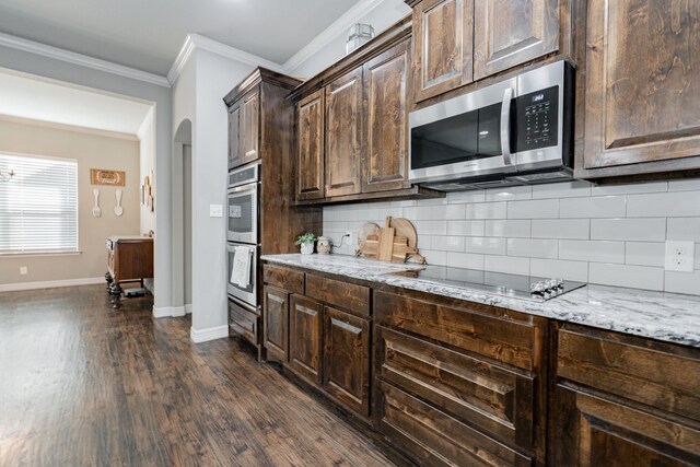 kitchen featuring dishwasher, hanging light fixtures, dark hardwood / wood-style floors, and sink