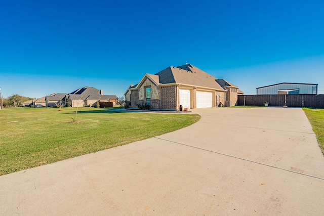 view of front facade with a garage and a front yard