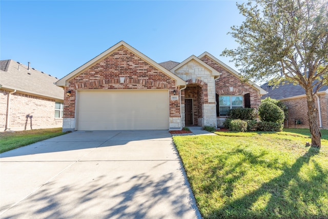 view of front of house with a garage and a front yard