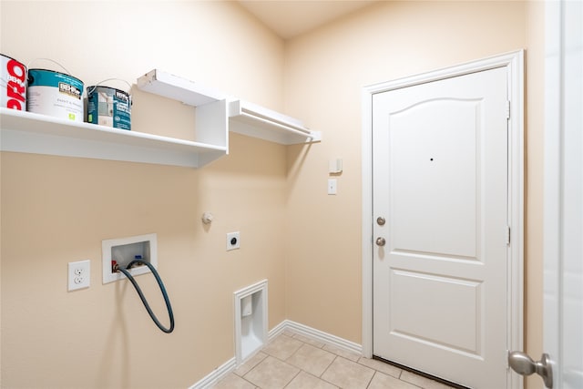 laundry area with electric dryer hookup, gas dryer hookup, hookup for a washing machine, and light tile patterned floors