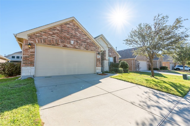 view of front property with a garage and a front lawn