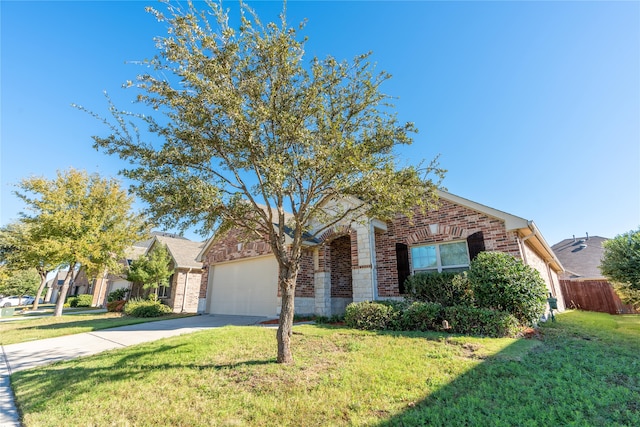 view of front of property featuring a garage and a front yard