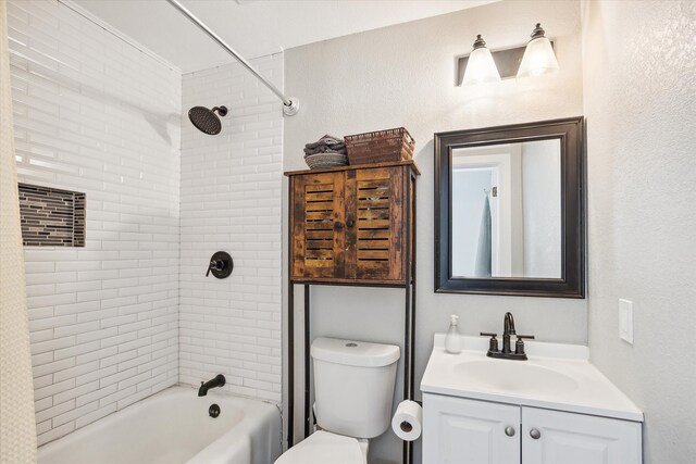 full bathroom with vanity, toilet, and tiled shower / bath combo