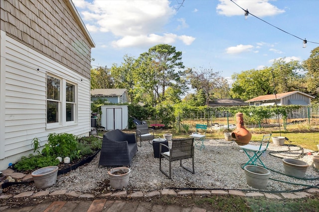 2505 Westbrook Ave, Fort Worth, TX 76111 - view of patio / terrace with a storage unit, fence, and an outdoor structure