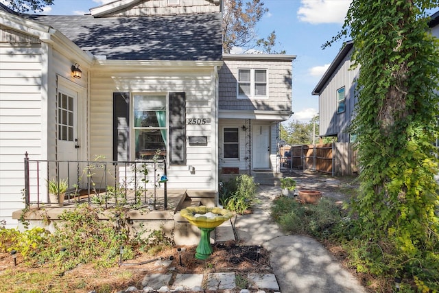 2505 Westbrook Ave, Fort Worth, TX 76111 - view of front facade with fence and a shingled roof