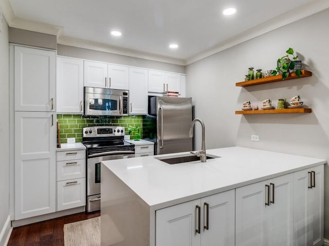 kitchen with white cabinets, sink, dark hardwood / wood-style flooring, and stainless steel appliances