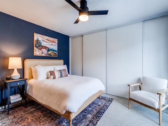 carpeted bedroom featuring ceiling fan