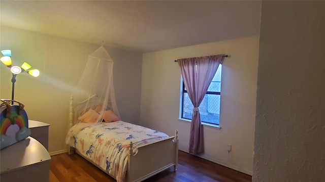 bedroom featuring dark wood-type flooring