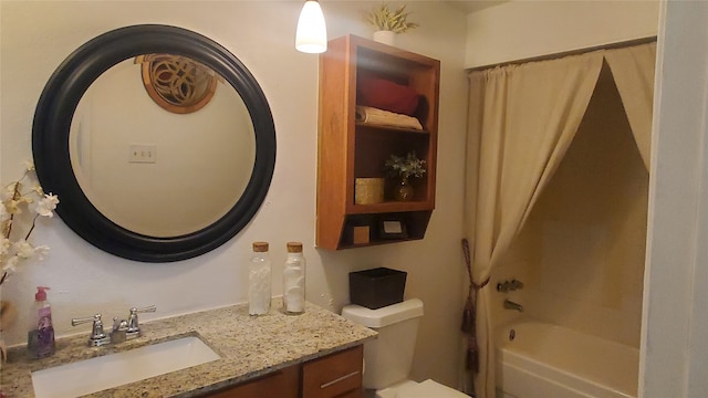 full bathroom featuring vanity, bathing tub / shower combination, and toilet