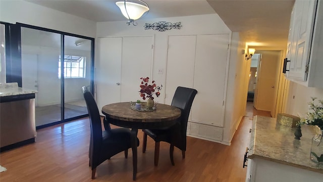 dining space featuring hardwood / wood-style floors