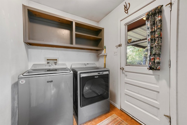 laundry area with independent washer and dryer