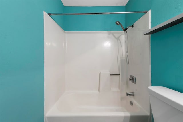 bathroom with toilet and tub / shower combination