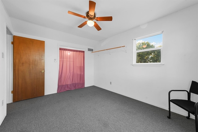 unfurnished bedroom featuring ceiling fan and carpet