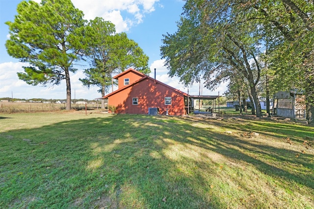 view of yard featuring central AC