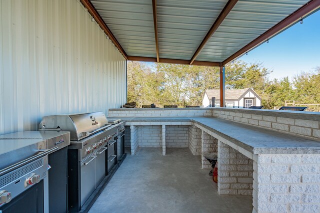 view of patio / terrace featuring an outbuilding, area for grilling, outdoor lounge area, and a playground