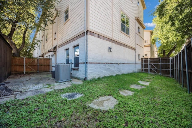 view of yard with central AC unit