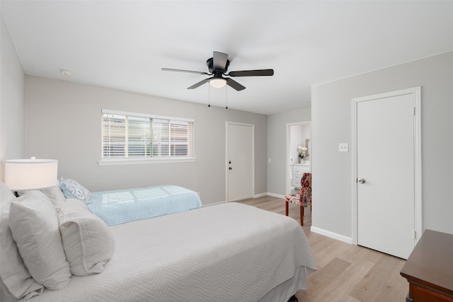 bedroom featuring light hardwood / wood-style floors and ceiling fan