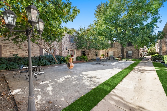 view of property's community with a patio