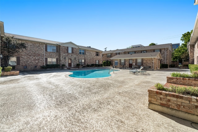 view of swimming pool with a patio