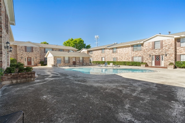 view of swimming pool with a patio