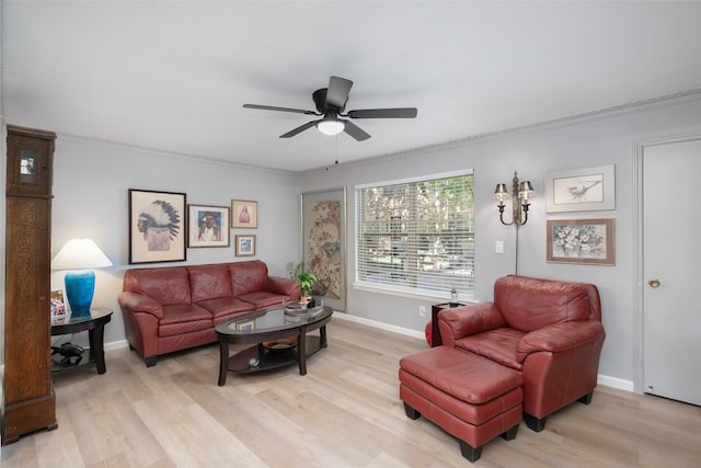 living room with light hardwood / wood-style flooring, ceiling fan, and crown molding