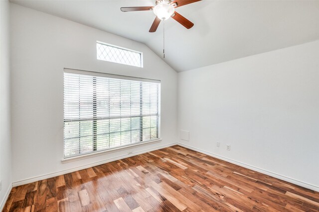 unfurnished room featuring lofted ceiling, ceiling fan, and hardwood / wood-style flooring