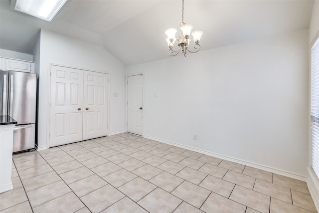 unfurnished dining area with light tile patterned flooring, vaulted ceiling, and a notable chandelier