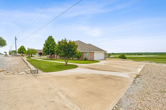 view of front of home with a garage and a front yard