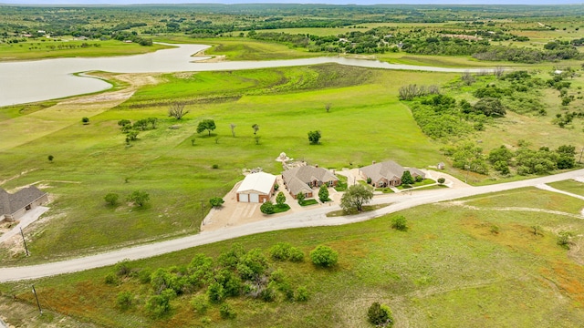 drone / aerial view featuring a rural view and a water view