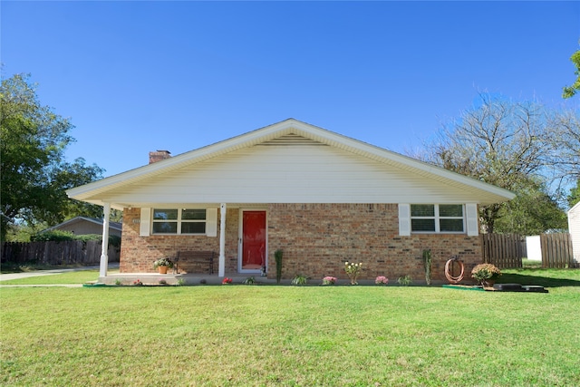 single story home featuring a front lawn