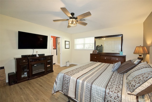 bedroom featuring ceiling fan and light hardwood / wood-style flooring