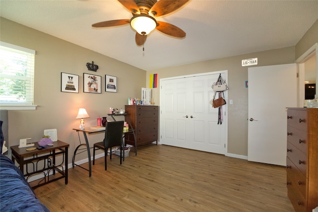 office area featuring ceiling fan, hardwood / wood-style floors, and a textured ceiling