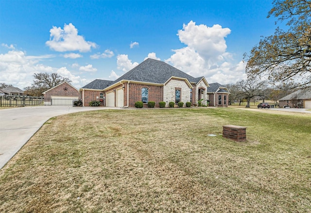 view of front of house with a front lawn and a garage