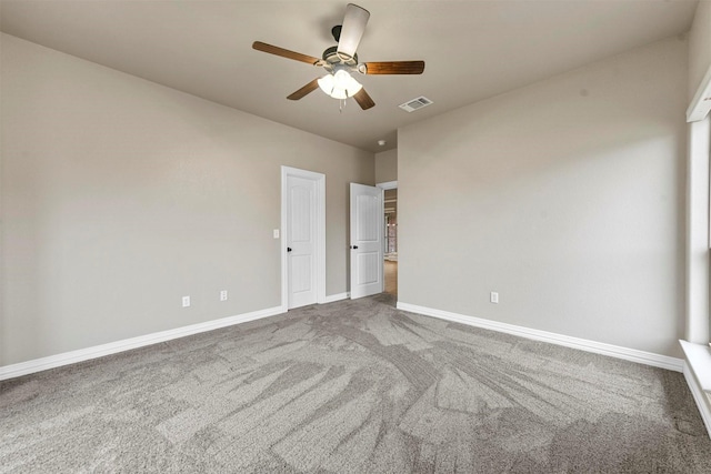 carpeted empty room with ceiling fan