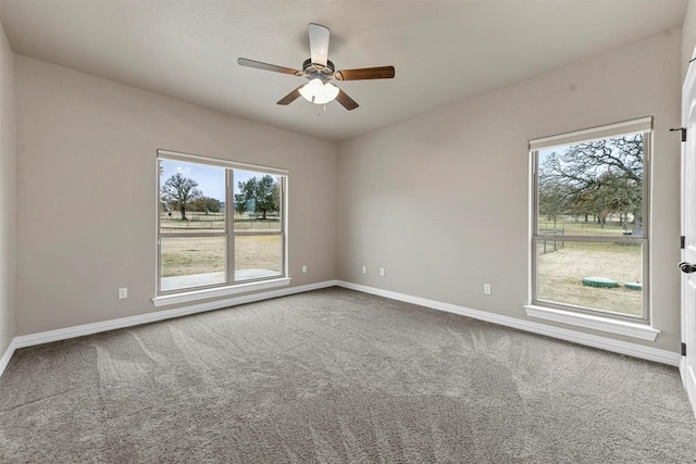 unfurnished room featuring carpet floors, ceiling fan, and a healthy amount of sunlight