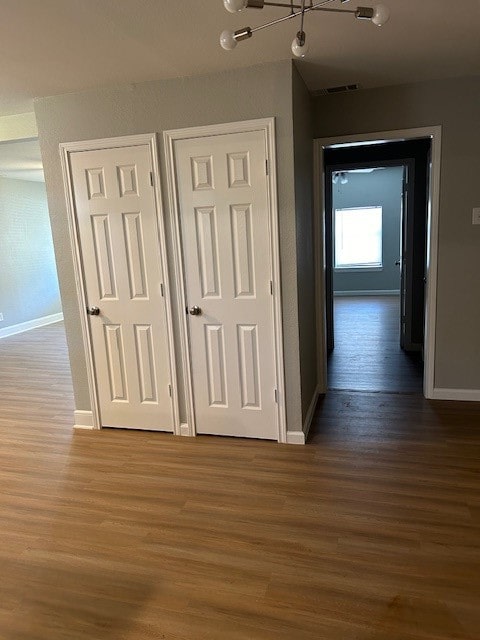 hallway featuring dark hardwood / wood-style flooring