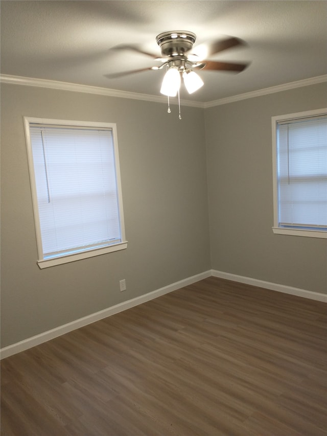 empty room featuring ceiling fan, dark wood-type flooring, and ornamental molding