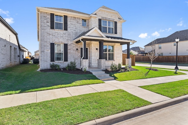 craftsman house featuring a front lawn