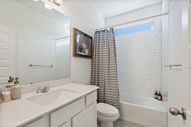 full bathroom with tile patterned floors, vanity, shower / tub combo, and toilet