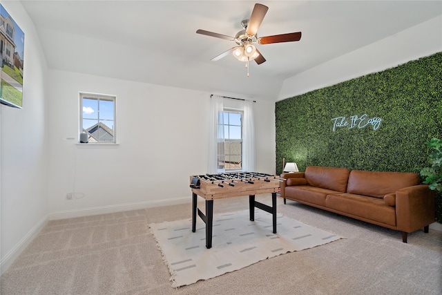 rec room featuring ceiling fan, plenty of natural light, and light colored carpet