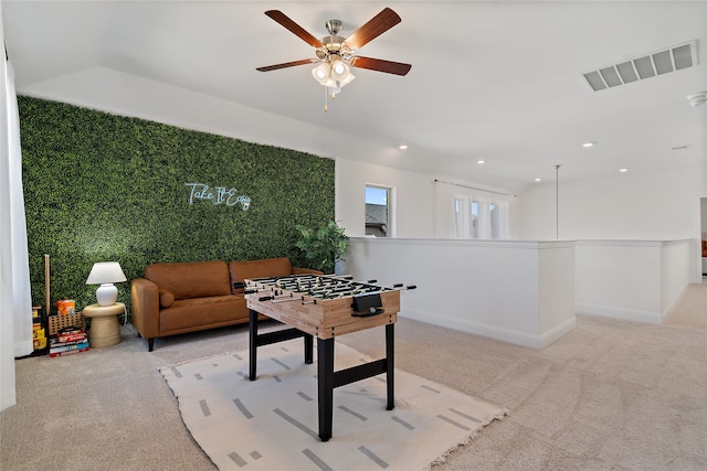 living room featuring light carpet and ceiling fan