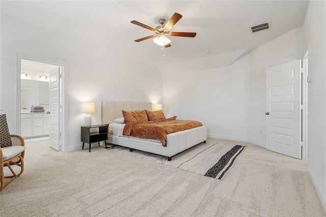 carpeted bedroom featuring connected bathroom, ceiling fan, and vaulted ceiling