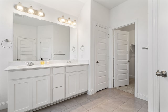 bathroom featuring tile patterned floors and vanity