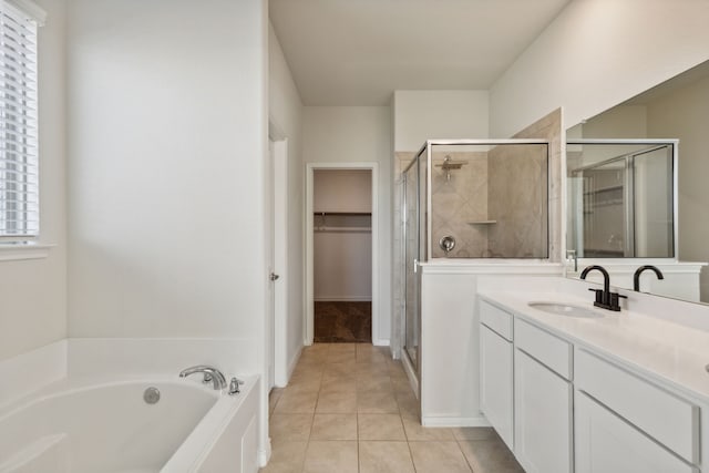 bathroom featuring vanity, tile patterned floors, and independent shower and bath