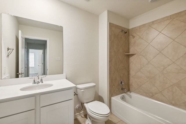 full bathroom with tile patterned floors, vanity, tiled shower / bath combo, and toilet