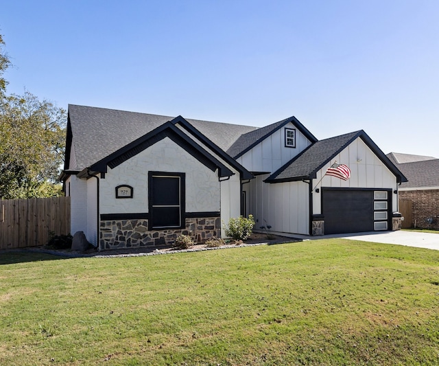 view of front facade featuring a garage and a front lawn